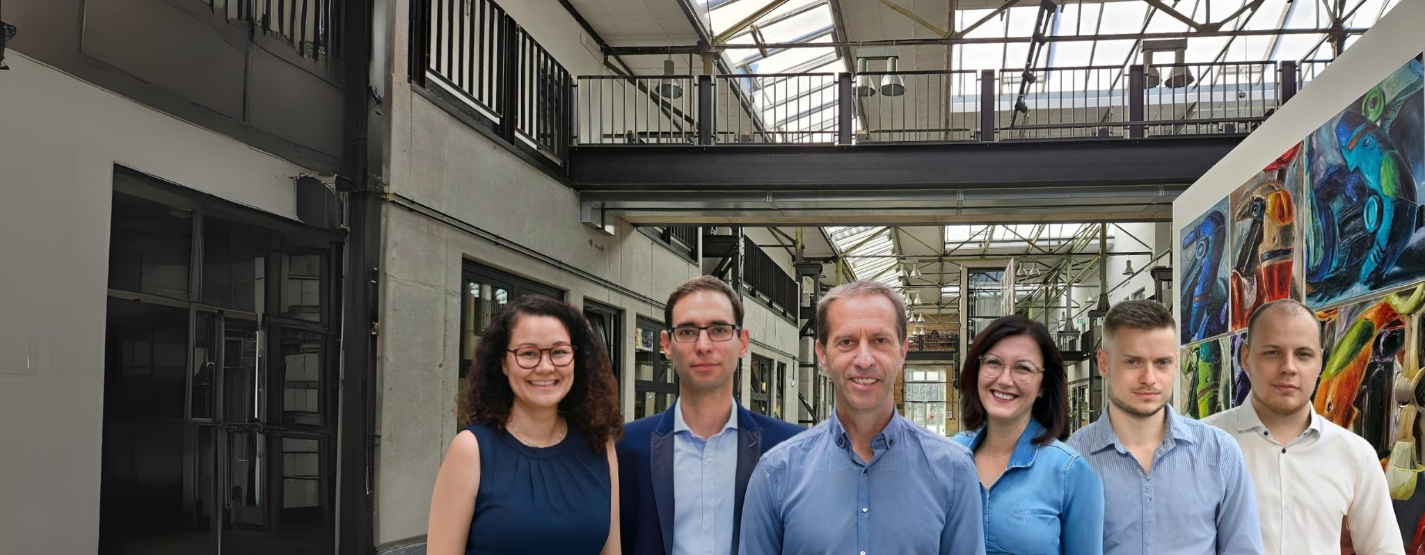 Das Team der tucore Unternehmensberatung – sechs Beraterinnen und Berater in der Loft-Atmosphäre des Standorts